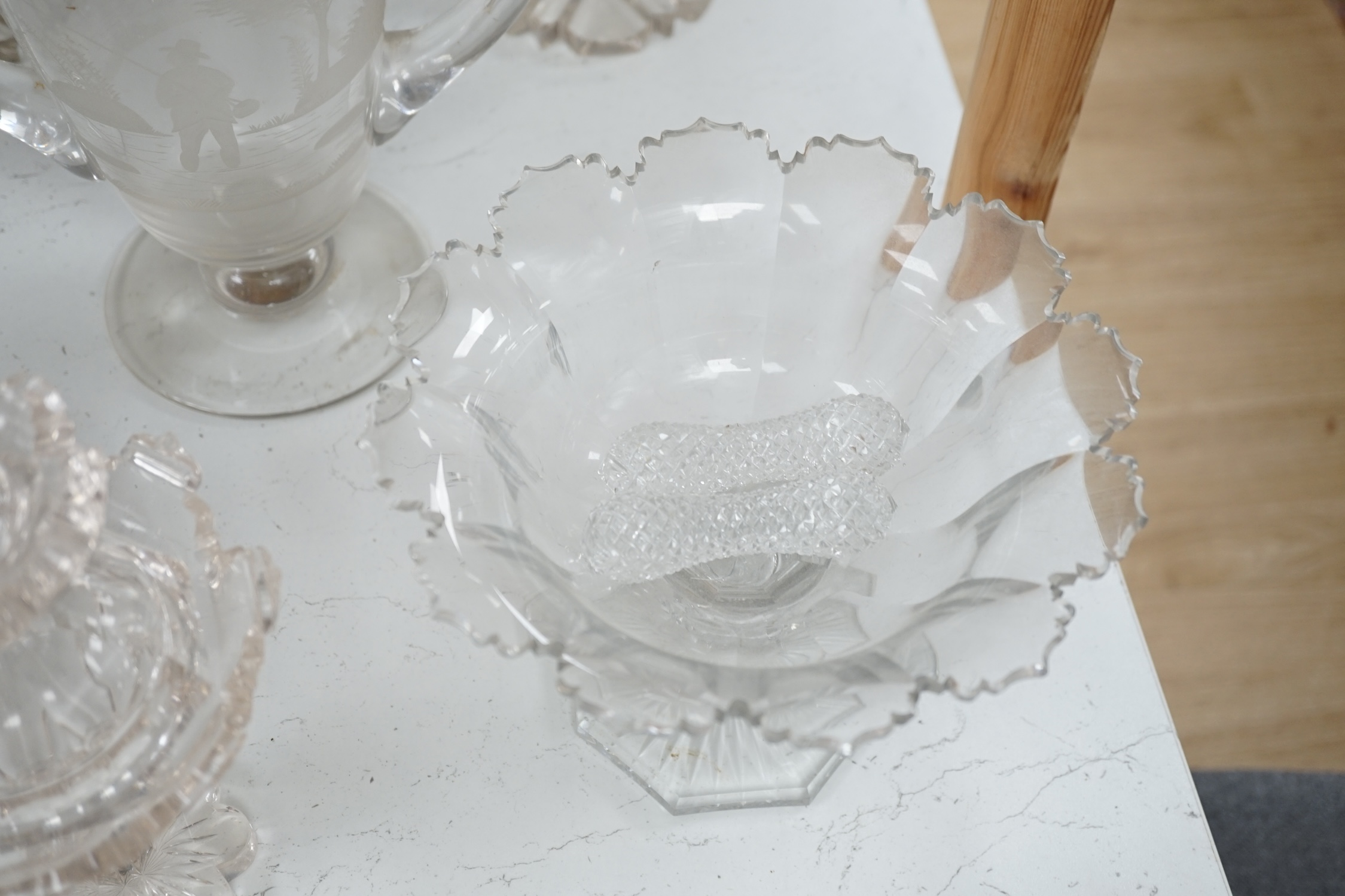 19th century and later glassware to include a pair of glass confitures (one cover), a twin handled etched cup, etc. largest 38cm high. Condition - fair